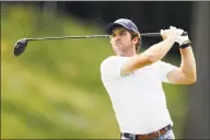  ?? Rob Carr / Getty Images ?? Denny McCarthy plays his shot from the 18th tee during Thursday’s first round of the Travelers Championsh­ip at TPC River Highlands in Cromwell.