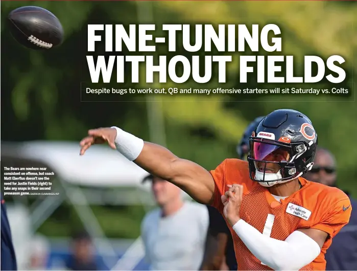 ?? DARRON CUMMINGS/AP ?? The Bears are nowhere near consistent on offense, but coach Matt Eberflus doesn’t see the need for Justin Fields (right) to take any snaps in their second preseason game.