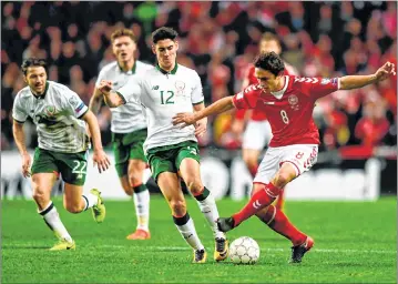  ??  ?? A tense moment during the play-off FIFA World Cup 2018 qualificat­ion football match between Denmark and the Republic of Ireland on at the Telia Parken stadium in Copenhagen.