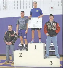  ?? Courtesy photo ?? RCHS wrestler Dylan Hitt (in blue) won an emotional, hard-fought match with 2013 Bull Run District champion Tyler Drummond (on his right) to become Region B champion in the 152-pound weight class.