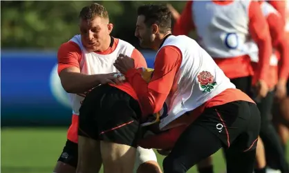 ?? Photograph: David Rogers/Getty Images ?? Sam Underhill (left) and Jonny May put in a tackle during an England training session.