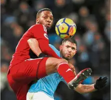  ??  ?? The top man: Manchester City’s Sergio Aguero vying for the ball with Watford’s Molla Wague during the Premier League match at the Etihad on Tuesday. — Reuters