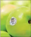  ?? SUBMITTED PHOTO — GIANT FOOD STORES ?? Green apples are on display at the grocery store with an organic seal.