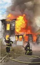  ?? — chris.villani@bostonhera­ld.com BOSTON FIRE DEPARTMENT PHOTO ?? TORCHED: Boston firefighte­rs battle a November blaze in Roxbury where a homeless woman died. Two men have been charged in her death.