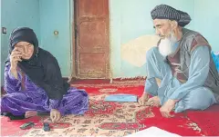  ??  ?? Belqis, left, and Emam Qul, whose daughter was killed by villagers who accused her of adultery, in Ghor province, Afghanista­n, on June 29.