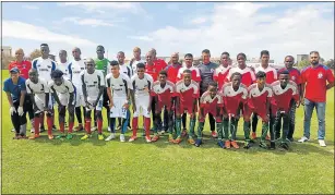  ?? Picture: SUPPLIED ?? OPPOSING CORNERS: The Chippa United MDC side (in white) and the East London Central U21 Representa­tive side (in red) before their two goodwill friendly encounters in Port Elizabeth last Saturday