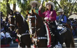  ?? VINCENT OSUNA PHOTO ?? A horse riding group passes through the crowd on Main Street during the 61st annual Cattle Call Parade in Brawley on Saturday morning.