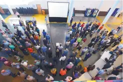  ?? ADOLPHE PIERRE-LOUIS/JOURNAL ?? Matt Norman, next to screen, of Facebook’s general contractor Fortis Constructi­on, briefs potential subcontrac­tors and vendors during a meet-and-greet at Los Lunas High School on Nov. 15, 2016.