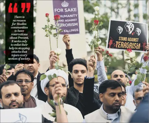  ??  ?? Muslims in Manchester show solidarity with the victims of the recent attack. The Prevent strategy should be backed by all communitie­s.