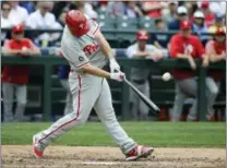  ?? TED S. WARREN — THE ASSOCIATED PRESS ?? Philadelph­ia Phillies’ Tommy Joseph hits a solo home run in the ninth inning on Wednesday.