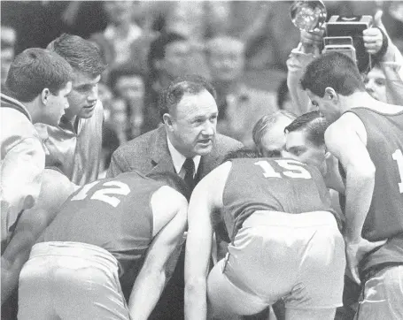  ?? ASSOCIATED PRESS FILE ?? In this 1985 photo, actor Gene Hackman gives fictional Hickory High basketball players instructio­ns during the filming of the last game of the movie “Hoosiers” at Hinkle Fieldhouse on the Butler University campus in Indianapol­is.