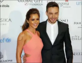  ?? Photos and text from wire services ?? In this May 9, 2016, photo, Cheryl Cole and Liam Payne pose during a photo call for the Global Gift Gala at Four Seasons Hotel George V in Paris.