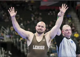  ?? COURTESY LEHIGH ATHLETICS ?? Lehigh senior Jordan Wood has his arm raised after placing third at the NCAA Championsh­ips Saturday in Detroit.