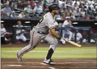  ?? RICK SCUTERI — THE ASSOCIATED PRESS ?? The Giants' David Villar doubles in his first major league at-bat during the second inning against the Diamondbac­ks on Monday.