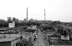  ??  ?? Chimneys of a coal-fired power plant are pictures in New Delhi, India. Indian power companies are seeking billions of dollars of federal funding to retrofit coal-fired plants to cut emissions, saying hefty tariff increases would otherwise be needed to...