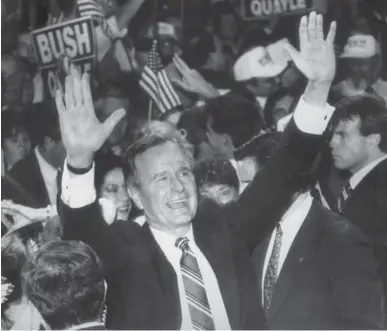  ?? BOSTON GLOBE ?? George H.W. Bush waves at his victory party after winning the presidency on Nov. 8, 1988.