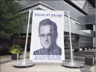  ?? Tyler Sizemore / Hearst Connecticu­t Media ?? A curtain depicting Judge Robert Drain, who is presiding over Purdue Pharma’s bankruptcy case, is displayed outside Purdue’s headquarte­rs at 201 Tresser Blvd in downtown Stamford on Wednesday.
