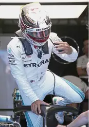  ?? — AP ?? Good start: Mercedes’ Lewis Hamilton getting out of his car at the end of the second practice session at the Australian Grand Prix in Melbourne yesterday.