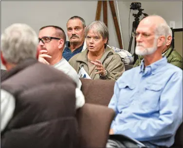  ?? (River Valley Democrat-Gazette/Hank Layton) ?? Carol Simpson (center) of Shadow Lake asks a question during the public hearing.