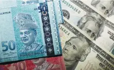 ??  ?? The ringgit is expected to remain volatile for the next three to six months.