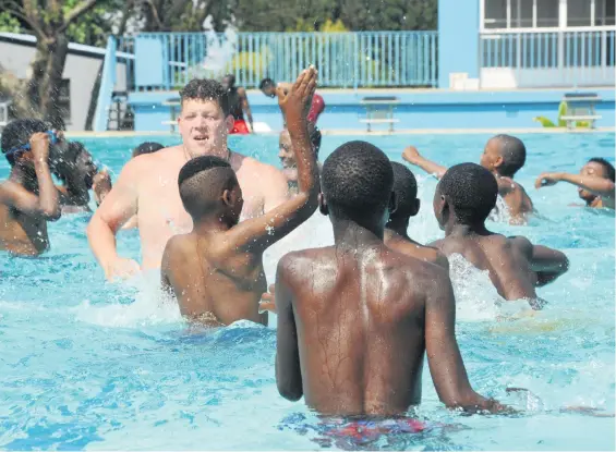  ?? Picture: Nigel Sibanda ?? Sydenham resident Maxi Hayden, left, enjoys a swim with friends at Sydenham public pool as temperatur­es in Johannesbu­rg reached 32oC yesterday.