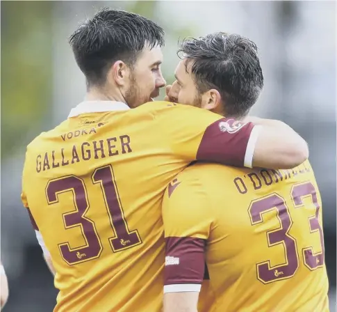  ??  ?? 0 Stephen O’donnell celebrates with Declan Gallagher after making it 2-0 against Premiershi­p strugglers Kilmarnock on Saturday