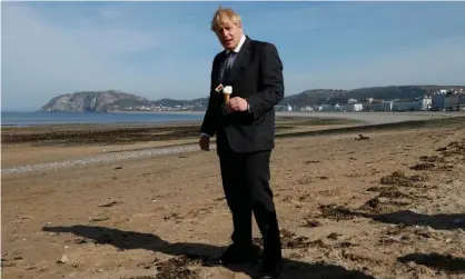  ??  ?? Boris Johnson on the beach in Llandudno, Wales. ‘He sees no reason to regulate himself in the interests of anybody but himself.’ Photograph: WPA pool/Getty