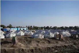  ?? ?? The tent city in Khairpur Nathan Shah, Dadu district, Pakistan, where Manzoor Ali and more than 50 families are still living in camps months after the floods. Photograph: Shah Meer Baloch