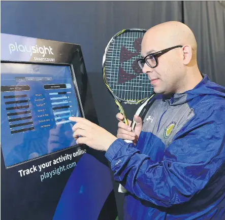  ?? JIM WELLS ?? Danny Da Costa, general manager of the Alberta Tennis Centre, demonstrat­es new technology that is now in place. The remote camera/app based program allows users to monitor every aspect of their tennis match and download stats afterward.