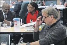  ?? CLIFFORD SKARSTEDT EXAMINER ?? City Coun. Dean Pappas attends a city council meeting for orientatio­n at the city's Community Services Dept. on Nov. 29. Newly elected councillor­s Stephen Wright and Kemi Akapo are in the background.