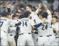  ?? Associated Press ?? Japan players celebrate after beating Mexico 6-5 during a World Baseball Classic semifinal game, Monday, in Miami.