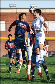  ?? Photo by Jerry Silberman / risportsph­oto.com ?? Central Falls senior Joeri Rodriguez (14) jumps for a header during the Warriors’ 8-2 Division I win over Coventry Tuesday.