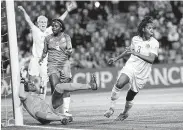  ?? Claude Paris / Associated Press ?? Kadeisha Buchanan, right, scored the lone goal in Canada’s win over Camerron in the opening round.