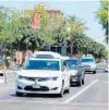  ?? KEVIN SPEAR/ORLANDO SENTINEL ?? A Waymo van shown here makes its way through suburban Phoenix traffic earlier this summer.