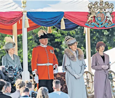  ??  ?? The presence of the royal coat of arms and the lavish costume worn by Geraldine James, second right, prompted fans to speculate that she plays Queen Mary in the new film