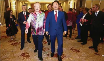  ??  ?? New envoy: MCA deputy president Datuk Seri Dr Wee Ka Siong with Bai Tian (in blue suit) at the ceremony.