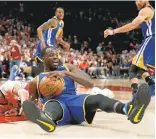  ?? RAY CHAVEZ/STAFF ?? The Warriors' Draymond Green grabs possession of a loose ball against Evan Turner of the Blazers on Sunday. Green was everywhere during the sweep.