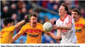  ??  ?? Alan Dillon of Ballintubb­er tries to get a pass away as he is closed down by Castlebar’s Cian Costello, Barry Moran, and Ray O’Malley in MacHale Park