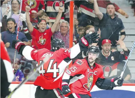  ?? JEAN LEVAC ?? Ottawa Senators defenceman Erik Karlsson, right, celebrates his game-winning goal against the New York Rangers with centre Jean-Gabriel Pageau during the third period of Game 1 of their Eastern Conference semifinal series at the Canadian Tire Centre in...