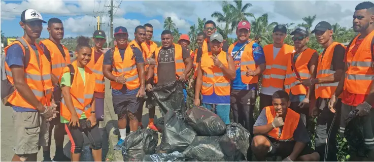  ?? Photo: Kelera Sovasiga ?? Members of the Veiyasana Rugby League Club during their clean-up campaign in Nakasi on February 27, 2021.
