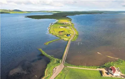  ?? Alamy ?? ABOVE
The causeway across to the Ness of Brodgar site.