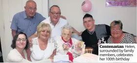  ??  ?? Centenaria­n Helen, surrounded by family members, celebrates her 100th birthday