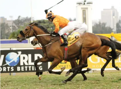  ?? Picture: Candiese Marnewick. See Page 8 ?? THRILLER. Weichong Marwing waves his crop in delight as Hemoso Mundo crosses the line ahead of Zante in the R1.25-million eLAN Gold Cup over 3200m at Greyville yesterday.