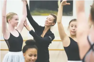  ??  ?? Michelle Mcmillan, centre, works with company members during a rehearsal for this week’s performanc­e.