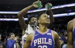  ?? MATT SLOCUM — THE ASSOCIATED
PRESS ?? Philadelph­ia 76ers’ Markelle Fultz, right, has water poured on him by Robert Covington after an NBA basketball game against the Denver Nuggets Monday in Philadelph­ia. Philadelph­ia won 123-104.