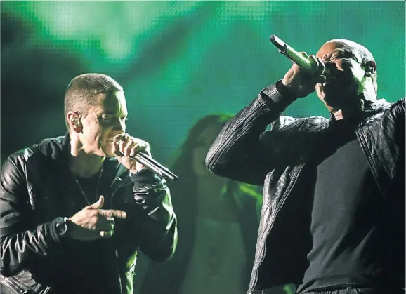  ??  ?? Eminem and Dr. Dre, right, perform at the 53rd Annual Grammy AwardsPict­ure: Gallo/Getty