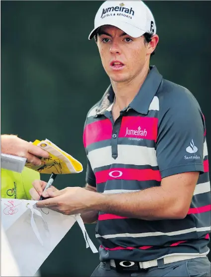  ?? — MCT ?? Rory Mcilroy signs autographs for fans during the Wells Fargo Championsh­ip Pro-am on Wednesday at Quail Hollow in North Carolina.