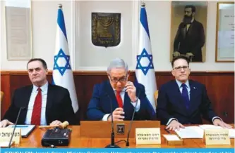  ??  ?? JERUSALEM: Israeli Prime Minister Benjamin Netanyahu opens the weekly cabinet meeting at his Jerusalem office yesterday. —AFP