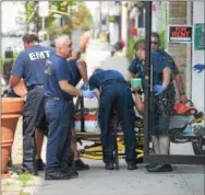  ?? PETE BANNAN — DIGITAL FIRST MEDIA ?? Coatesvill­e emergency medical providers treat a man who overdosed in an apartment on the 100 block of Lincoln Highway on Thursday. The nan was taken to Brandywine Hospital Thursday.