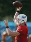  ?? WILFREDO LEE — THE ASSOCIATED PRESS ?? Dolphins quarterbac­k Ryan Tannehill throws during training camp Thursday Davie, Fla. in